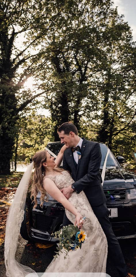 Groom holding Bride