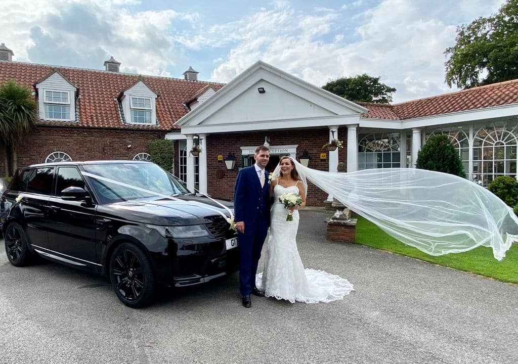 CPW Chauffeur Services Wedding Couple Outside the Bridge Walshford